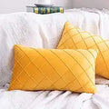 Grid pattern cotton pillow cover in forest green on a textured sofa